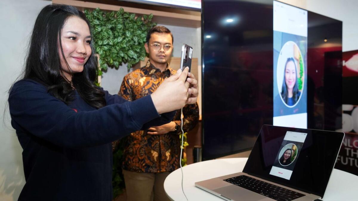 UJI COBA -- Pelaksanaan uji coba registrasi pelanggan berbasis biometrik untuk memperkuat keamanan ekosistem digital.