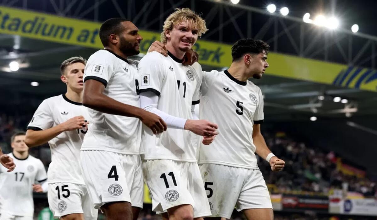 Selebrasi Nick Woltemade setelah mencetak gol pertamanya untuk timnas senior Jerman. (AFP/Paul Faith)